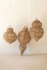 SET OF THREE LARGE WOVEN SEAGRASS AND IRON ORNAMENTS