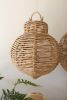SET OF THREE LARGE WOVEN SEAGRASS AND IRON ORNAMENTS