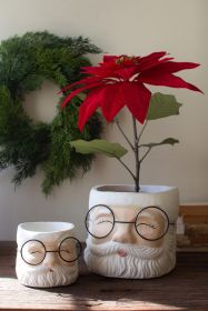 SET OF TWO CONCRETE SANTA PLANTERS