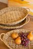 SET OF THREE WOVEN VINE OVAL TRAYS WITH HANDLES