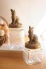 SET OF TWO RESIN AND GLASS RABBIT CANISTERS