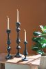 SET OF THREE PATINA METAL CANDLE TOWERS