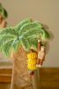 SET OF TWO CERAMIC PALM TREE VASES
