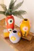 SET OF THREE CERAMIC VASES WITH FLOWERS