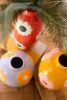 SET OF THREE CERAMIC VASES WITH FLOWERS