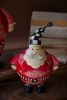 SET OF TWO PAINTED METAL SANTAS WITH CHECKERED DETAIL