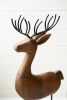 SET OF THREE CARVED WOOD AND IRON REINDEER ON BASES