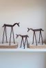SET OF THREE FORGED-IRON HORSES