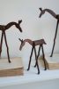 SET OF THREE FORGED-IRON HORSES