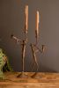 SET OF TWO FORGED IRON TRUMPET AND SAXAPHONE TAPER CANDLE HOLDERS