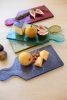 SET OF FOUR COLORED GLASS CHEESE BOARDS - ONE EACH COLOR