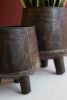 SET OF TWO HAND - HAMMERED IRON PLANTERS WITH LEGS