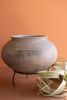 BLACK CLAY URN ON AN IRON STAND