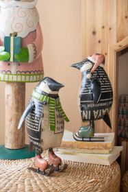 SET OF TWO RECYCLED METAL SKATING CHRISTMAS PENQUINS