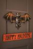 HAPPY HAUNTING BAT DOOR HANGER