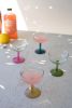SET OF FOUR COUPE GLASSES WITH COLORED STEMS