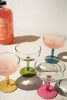 SET OF FOUR COUPE GLASSES WITH COLORED STEMS