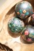 SET OF FOUR HAND PAINTED WOODEN SPHERES